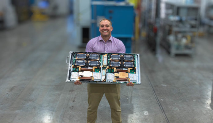 Patrick-with-HPE-Cray-EX-AMD-EPYC-and-Instinct-MI250X-Node-at-CoolIT-Systems-696x403.jpg